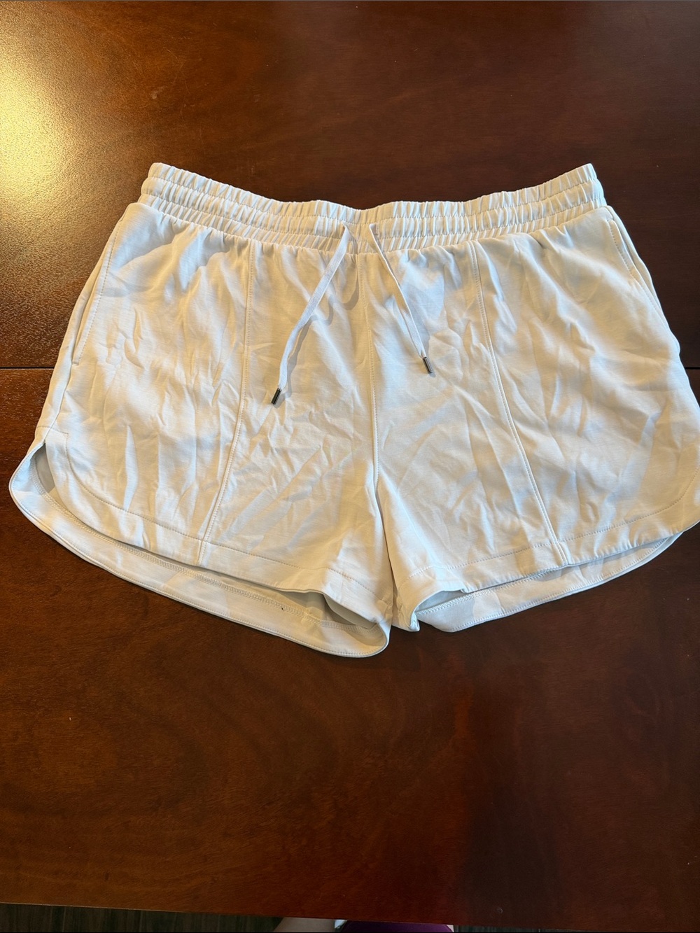Women's White Drawstring Dolphin-hem sand wash Shorts with pockets